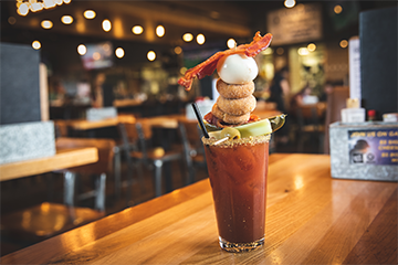 A bloody mary served with lots of condiments at Northern Tap House 