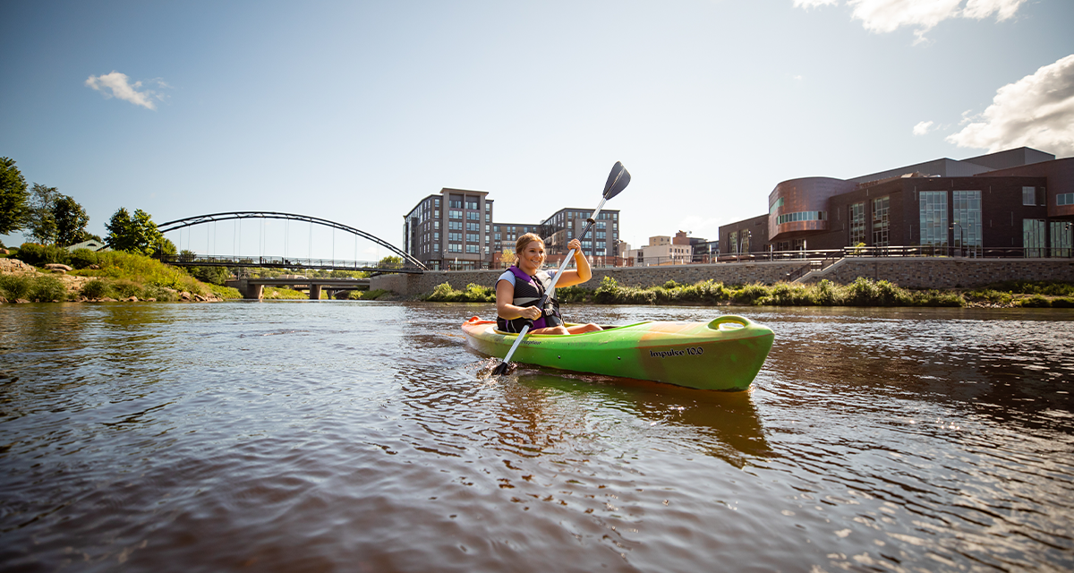 A woman kayaking at the Confluence of the Eau Claire and Chippewa Rivers 
