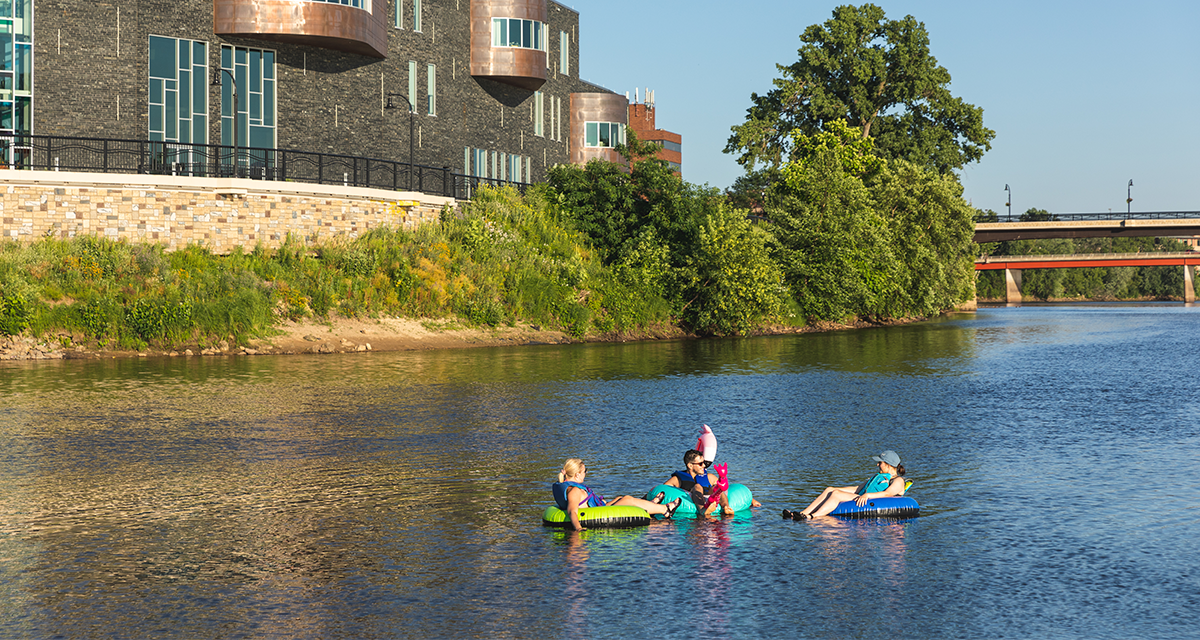 two girls and a guy floated down the Chippewa River on tubes in Eau Claire