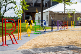 Colorful bike rack that spells out River Prairie in River Prairie Park 