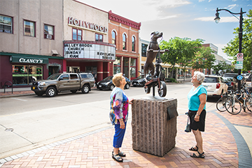 Two women admiring a sculpture in downtown Eau Claire 