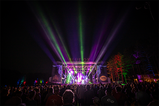 The main stage and crowd at night at Blue Ox Music Festival 