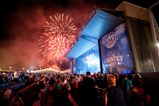 The Country Fest stage at night with fireworks in the sky 