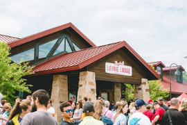 Crowd in front of the Leinie Lodge at the Jacob Leinenkugel Brewing Company 