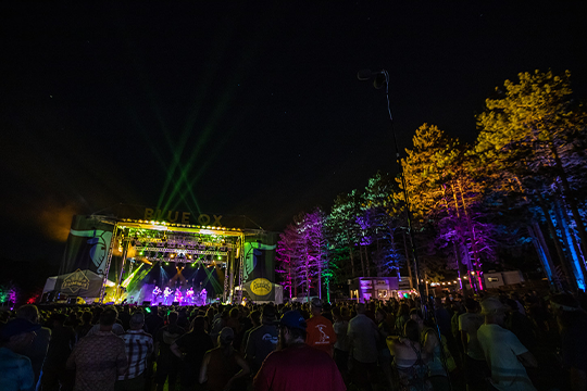 The stage lit up at night at Blue Ox Music Festival 